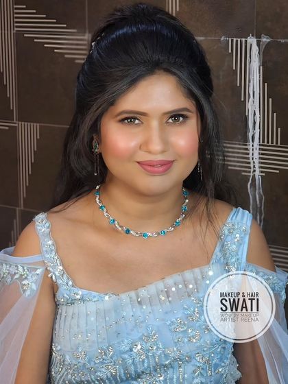 An elegant engagement look by my artist Swati. The bride is wearing a beautiful powder blue gown with off-shoulder sleeves.