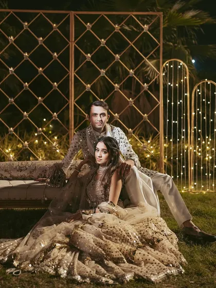 A dreamy, romantic portrait for a Garba night. The soft lighting and the couple's relaxed pose create an image that is both elegant and intimate.