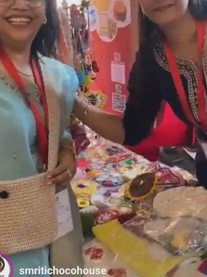 Another happy customer trying on one of my crochet sling bags at an event. Her smile says it all.