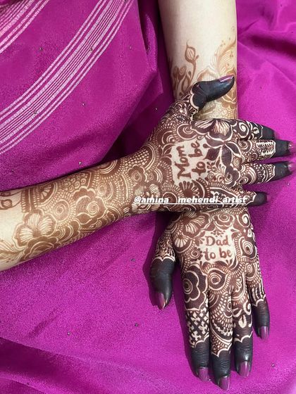 A special design for the parents-to-be. This mehendi features "Mom to be" on one hand and "Dad to be" on the other, woven into a lovely floral pattern.