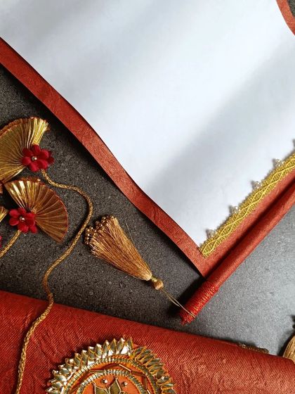 Another view of the unrolled wedding scroll, highlighting the elegant lace border and the rich texture of the handmade paper.