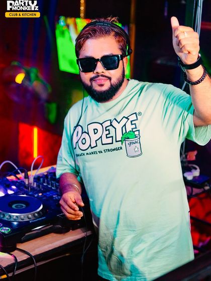 When in doubt, give a thumbs up. A fun, positive shot of me at the DJ booth, connecting with the crowd.