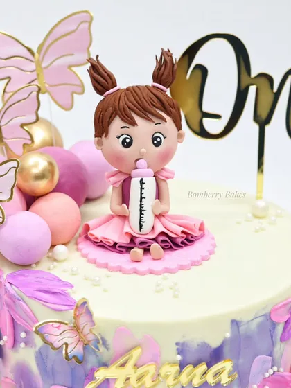 A close-up of the adorable figurine on the butterfly cake.