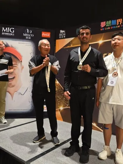 Ranveer Singh Saini on the podium after securing a silver medal at the Golf Masters in Macau, his 8th medal at this prestigious event against the world's best teams.