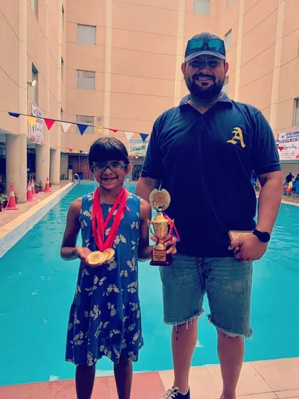 Here I am with another of our young champions, celebrating her victory with a medal and trophy. My mission is to identify potential and provide the guidance needed to transform that talent into tangible accolades and a lifelong love for the sport.