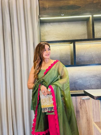 Another angle of the olive and fuchsia suit, showcasing the elegant scallop detailing. It’s these small, thoughtful touches that elevate an outfit from simple to stunning.