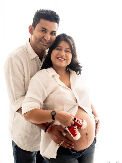 It's all about the little details! Using tiny baby shoes as a prop makes the anticipation so tangible in these sweet couple pregnancy pictures.