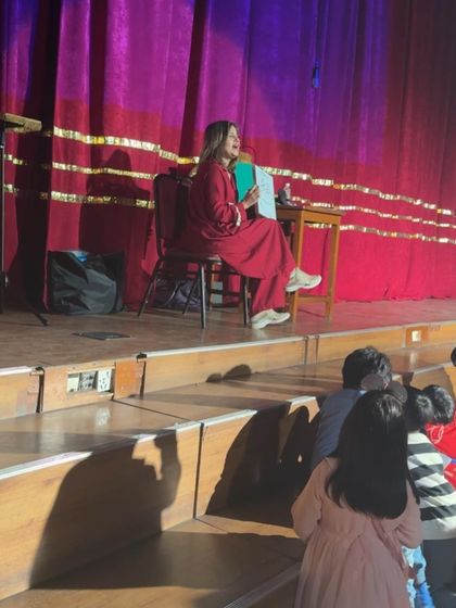 Sitting down for a storytelling segment of the show. I mix different formats to keep the energy high and the audience hooked.