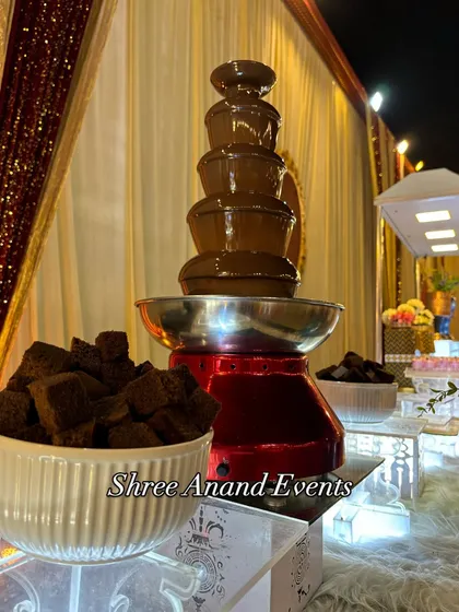 A classic centerpiece for any celebration, this multi-tiered chocolate fountain is always a guest favorite. I serve it with a variety of dipping options like fresh fruit and brownie bites, making for a fun and decadent dessert experience.