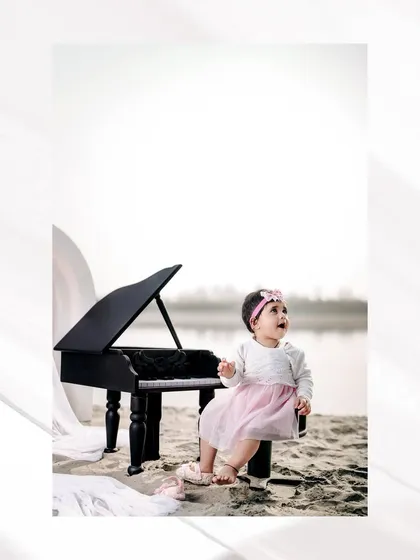 Looking up at the sky for inspiration. This little pianist is lost in her own world, creating a beautiful and contemplative portrait.