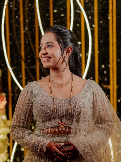 A candid shot of the bride, her smile radiant and her makeup flawless.
