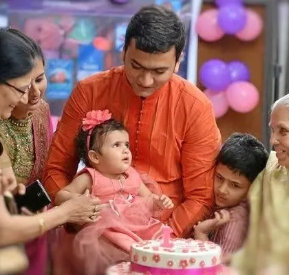 The whole family, including grandparents, gathered for the cake cutting. These are precious memories that bring everyone together.
