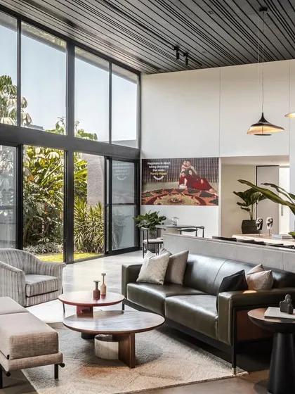 The lounge area of the marketing office is designed to feel like a comfortable and stylish living room, putting potential clients at ease.