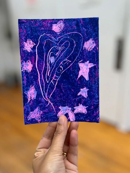 A whimsical heart and stars drawing, showcasing the imaginative power of our young artists using the sgraffito oil pastel technique.