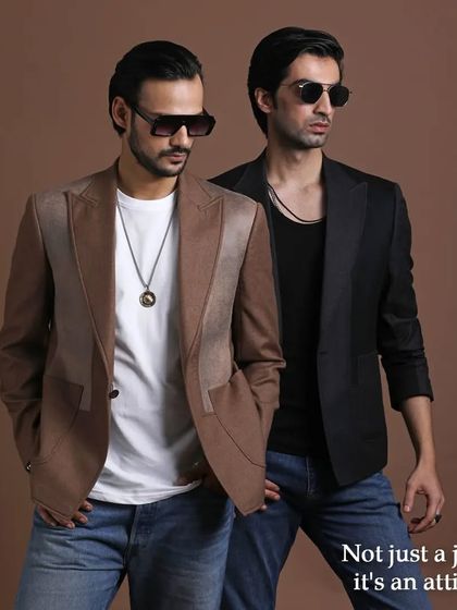 Two blazers, two attitudes. This image shows how a simple jacket can define a look, whether it's the earthy brown or the classic black.