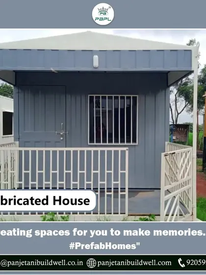 We create spaces for you to make memories. This compact and modern prefabricated house, complete with a small porch, is a perfect example of our efficient and stylish housing solutions.