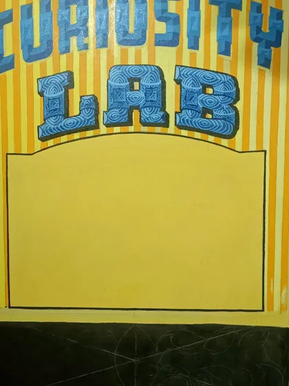 The "Curiosity Lab" sign in an intermediate stage.
