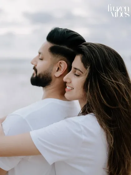 A gentle, happy moment between Komal and Harman on the beach in Phuket. This candid shot captures the relaxed feeling of a destination pre-wedding shoot.