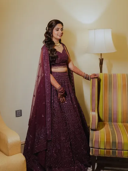 The full Sangeet look for Kajol. Her makeup, hair, and stunning purple lehenga all come together for a perfect evening of celebration.