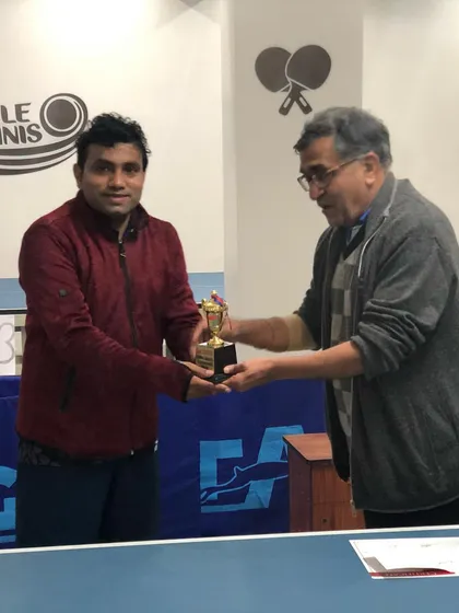 Anil Revelia, the runner-up, receiving his well-deserved trophy. The final match was intense, and his performance throughout the league-cum-knockout tournament was outstanding.