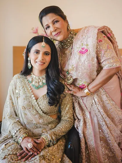 One of my favorite moments to witness is the bond between a mother and daughter. Here, I created complementary looks that celebrated both of their individual styles while maintaining a cohesive, elegant feel for the wedding day.