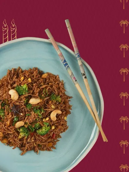 A delicious plate of burnt garlic fried rice with cashews and broccoli. This dish, prepared for a birthday celebration, highlights our ability to create customized and flavourful main courses.