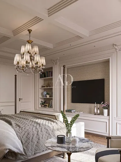 The classic four-poster bed is given a modern interpretation in this design. The room also features built-in shelving for a television and decor, seamlessly blending modern needs with timeless style.