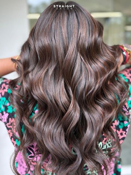 A full back view of the glossy mocha waves, showing off the volume and rich color.