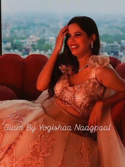 The bride-to-be glowing with happiness during her Roka. This candid shot shows how the makeup looks natural and flawless, even in ambient lighting.