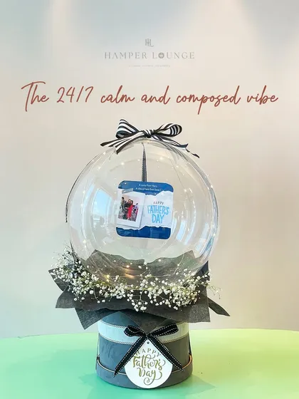For the dad who has a calm and composed vibe, this unique gift features a personalized photo inside a clear bubble balloon. It's a modern and minimalist gift that still feels incredibly personal.