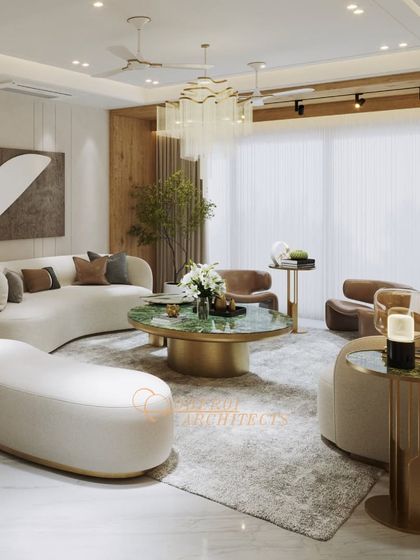 This living space is designed to captivate and inspire, with soft curves in the sofa, a rich green marble coffee table, and a statement chandelier.