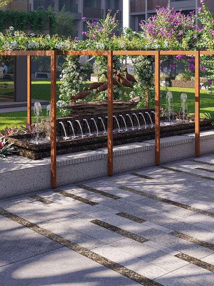 This 3D render shows a water feature with a dynamic sculpture of a leaping figure. The feature is framed by a wooden pergola, creating a powerful focal point within the community garden.