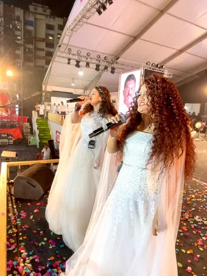 Performing on stage in beautiful white gowns. We love to coordinate our outfits to create a stunning visual for the audience.