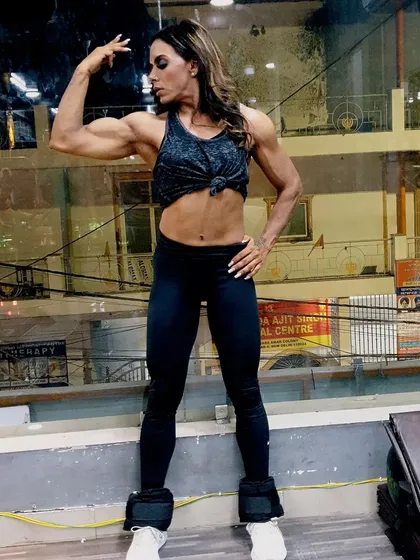 Even with ankle weights on for a different workout, you can see the upper body definition. A holistic nutrition plan ensures your entire body gets what it needs to grow stronger.