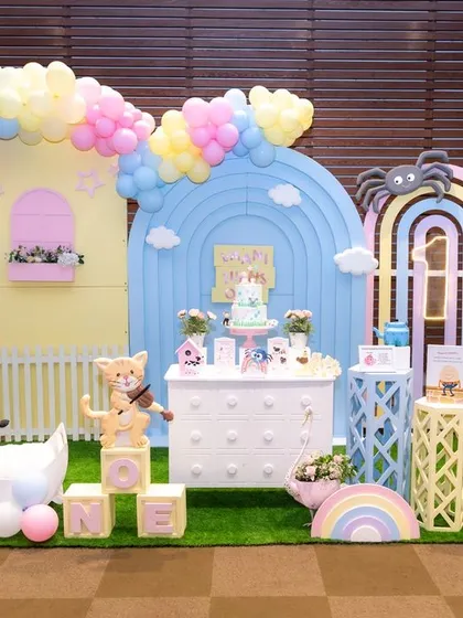 A wide shot of an elaborate and whimsical nursery-themed first birthday party decor. We make sure to photograph the beautiful setup and details you've worked so hard to create for your event.