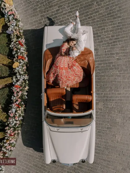 A vintage car, a beautiful couple, and a unique perspective from above. I always look for creative ways to frame your love story, making it truly one of a kind.