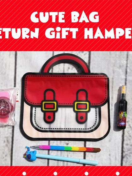 This flat lay shows the contents of the cute bag hamper: a watch, a pen, and other stationery, all fitting neatly inside the bag.