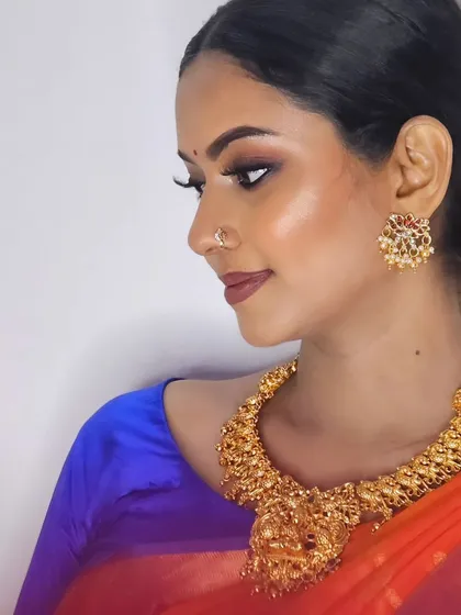 A side profile of my self-makeup look, showing the glowing skin and defined features.