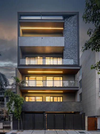 Embracing sustainability with sleek elegance, this builder floor in South Ex-2 uses glass and aluminum for a modern, eco-friendly design. The expansive balconies invite open air and natural light into the home.