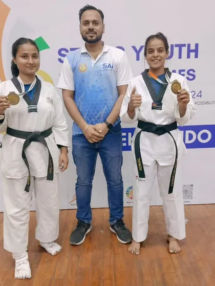 Our senior female athletes showcasing their gold medals at the Stairs Youth National Games. We provide specialized training for elite competitors aiming for national recognition.
