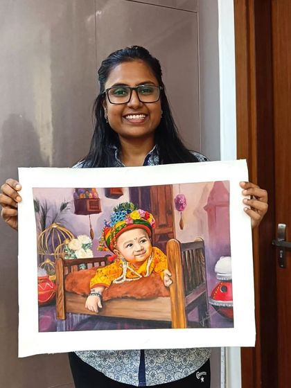 Me holding the finished baby Kanha portrait.