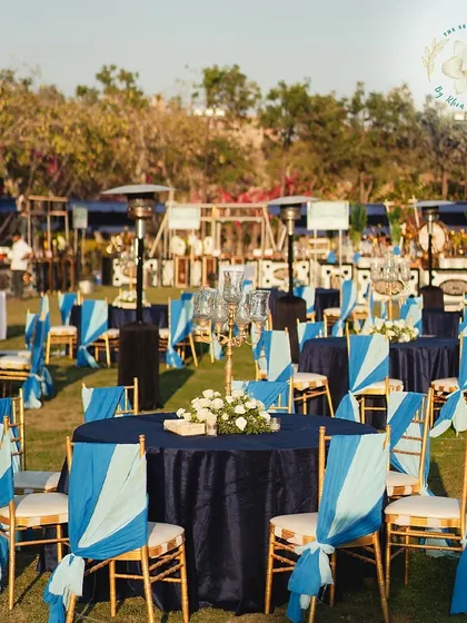 The full view of the Mehendi-Sangeet dining area, with its beautiful blue and gold theme, ready for a night of celebration.