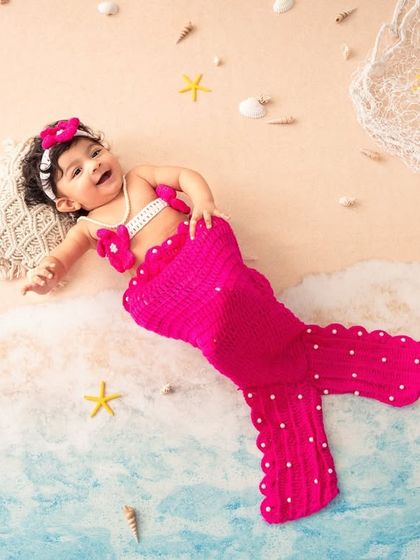 A beautiful portrait of our little mermaid. This creative theme is a magical way to capture a special milestone.