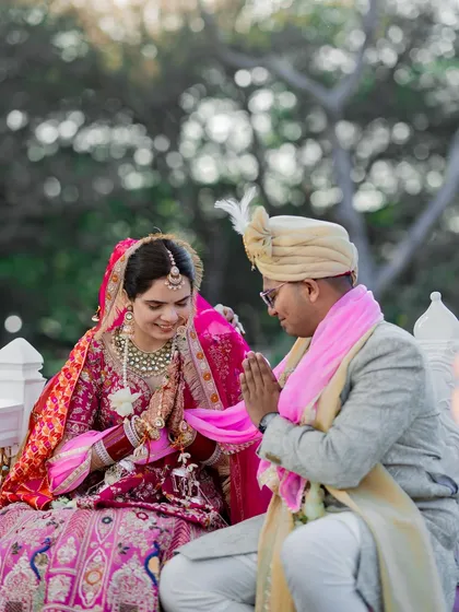 A moment of respect and tradition during the wedding ceremony, as the couple performs a ritual together.
