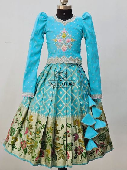 The same long-sleeved lehenga design in a bright sky blue, showing how I can customize colors.