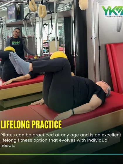 Pilates is an excellent lifelong fitness practice because it evolves with your individual needs. This client is performing a core exercise on the reformer, tailored for her fitness level.