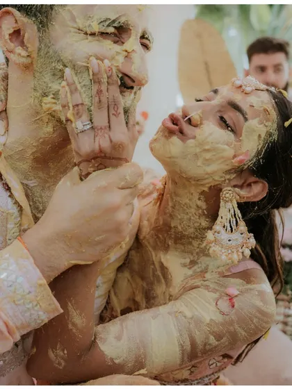 This is the beautiful chaos I love to capture. A Haldi ceremony is not about clean shots; it's about uninhibited joy, playful moments, and the kind of laughter that you can almost hear just by looking at the photo.
