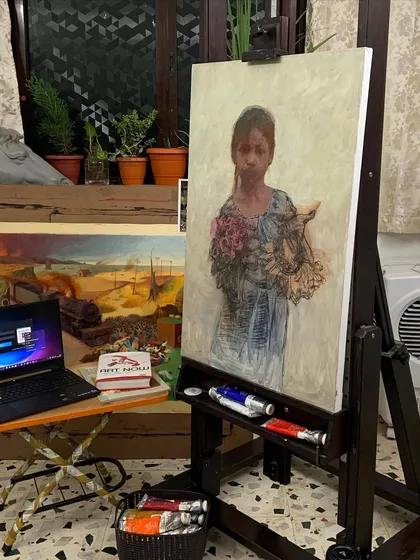 The "Hope of Innocent Flowers" painting on an easel in my studio, showing it in a work-in-progress context.
