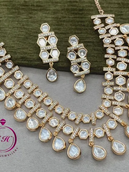 This is a premium quality real Kundan jewellery set. The intricate design and craftsmanship make it a standout piece for any special occasion.