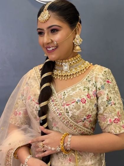 This bride looks absolutely gorgeous with her traditional gold jewelry and nath. I gave her a classic Indian bridal makeup look with pink eyeshadow and a defined lip.